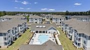 Columbia apartment for rent - A large apartment complex with a swimming pool in the center.