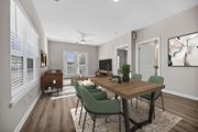 Columbia apartment for rent - A dining room with a wooden table and green chairs.