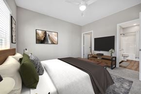 Columbia apartment for rent - A bedroom with a large bed and a flat screen TV.