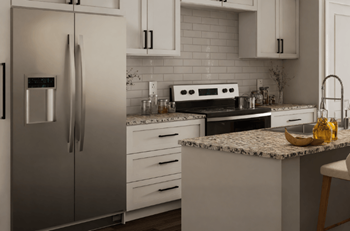 A modern kitchen with a refrigerator, stove, and countertop.