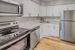 Leesburg apartment for rent - White cabinetry in kitchen at Tuscarora Creek, Leesburg, Virginia