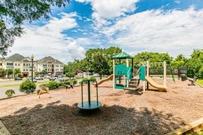 Manassas apartment for rent - A playground with a green slide and a yellow slide. at Barrington Park Apartments, Manassas, VA, 20110