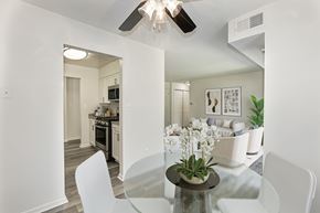 Fairfax apartment for rent - A modern dining room with a glass table and white chairs at Fairfax Square Apartments, Apartments, Fairfax, VA