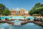 Fairfax apartment for rent - A large building with a pool in front of it. at Fairfax Square Apartments, Virginia, 22031