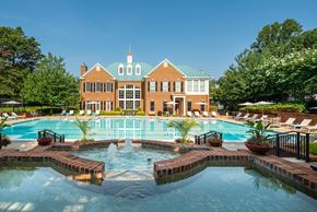 Fairfax apartment for rent - A large building with a pool in front of it. at Fairfax Square Apartments, Virginia, 22031