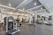Woodbridge apartment for rent - A gym with a variety of equipment including treadmills, weights, and exercise machines. at Kensington Place Apartments, Woodbridge, Virginia