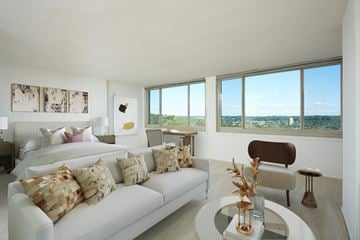 Alexandria apartment for rent - A living room with a white couch and a glass table.