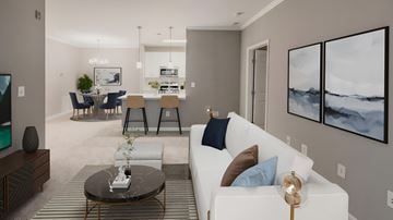Herndon apartment for rent - A modern living room with a white sofa and a coffee table.