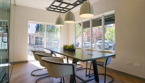 Chicago apartment for rent - a dining room with a table and chairs and a large window