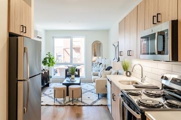 Evanston apartment for rent - A modern kitchen with a refrigerator, stove, and sink.