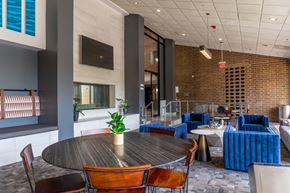 Naperville apartment for rent - A modern dining area with a round table and chairs.