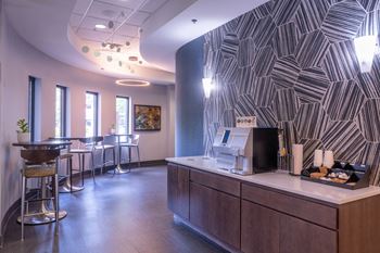 Coffee station with geometric tile feature wall