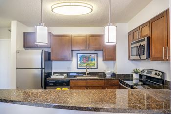 Kitchen with granite counters and pendant lighting