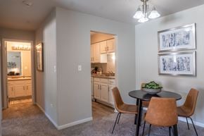 Mundelein apartment for rent - A dining room with a table and chairs is shown.