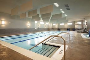 St. Charles apartment for rent - A large indoor swimming pool with lanes marked for swimming.