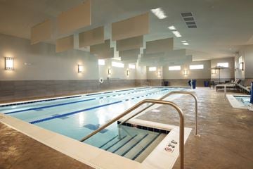 St. Charles apartment for rent - A large indoor swimming pool with lanes marked for swimming.