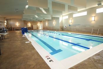 24/7 Indoor aquatic center with hot tub and lap pool