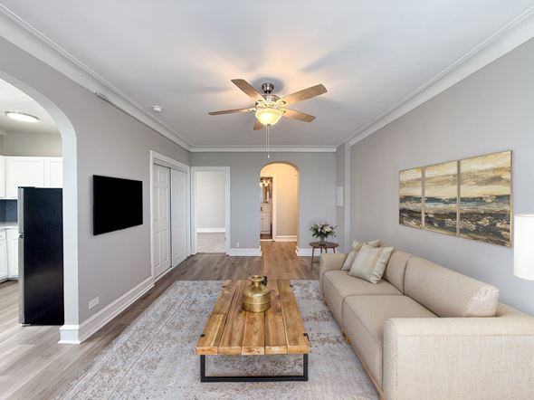 Chicago apartment for rent - A modern living room with a wooden coffee table and a beige sofa.