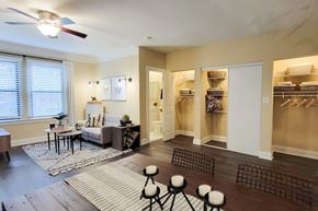 Chicago apartment for rent - A well-lit room with a couch, chairs, and a rug.