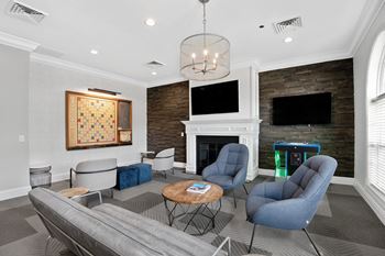 Resident lounge with fireplace and comfortable seating
