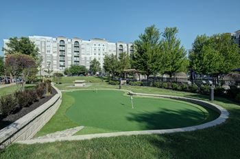 Miniature golf course with putting green and landscaping