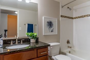 Bathrooms with tile flooring & granite countertops