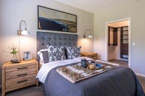 Vernon Hills apartment for rent - Bedroom with tufted headboard and walk-in closet at TLC Management Apartments, Illinois, 60061