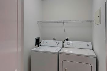 Inunit laundry room with washer and dryer