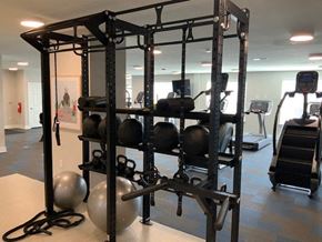 Hickory apartment for rent - a gym with weights and other equipment in it