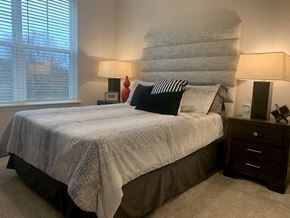Hickory apartment for rent - a small bedroom with a bed and a large wall