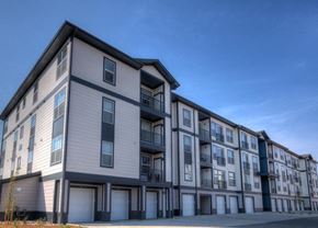 Denver apartment for rent - an image of an apartment building with a blue sky