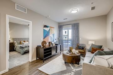 Greeley apartment for rent - a living room with a couch and a table
