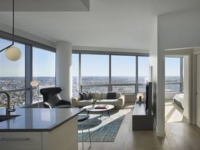 Philadelphia apartment for rent - A modern living room with a view of the city.