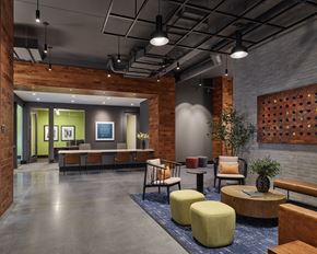 Philadelphia apartment for rent - A modern office space with a wooden wall and a grey floor.