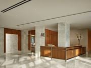 Florham Park apartment for rent - A reception area with a wooden desk and a sign that reads "Avenue.".