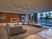 Florham Park apartment for rent - A modern living room with a fireplace and a large window.