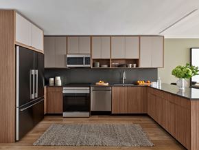 White Plains apartment for rent - A modern kitchen with wooden cabinets and stainless steel appliances.
