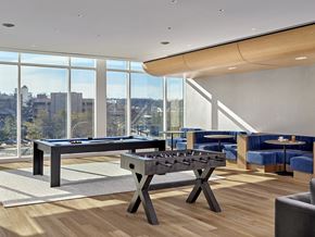 White Plains apartment for rent - A pool table in a room with a view of the city.