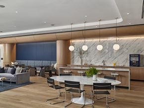 White Plains apartment for rent - A modern dining area with a marble counter and black chairs.