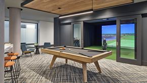 Philadelphia apartment for rent - A pool table in a room with a view of a golf course.