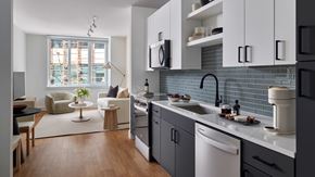 Philadelphia apartment for rent - A modern kitchen with a dining area and a window.