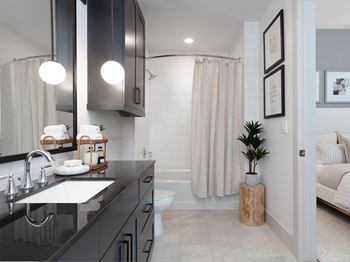 Showers with glass doors and benches or deep-soaking tubs and tile-surround