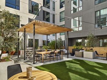 Zen courtyard featuring yoga lawn, grilling stations and dining pavilion, fire pits, comfortable seating and lush landscaping