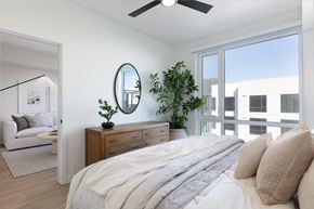Santa Clara apartment for rent - a bedroom with a large bed and a large window at AVE Santa Clara, Santa Clara, CA