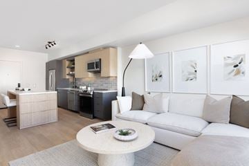 Santa Clara apartment for rent - A modern living room with a white sofa and a grey rug.