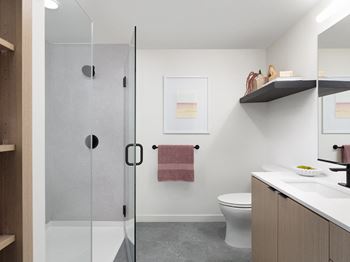 Showers with glass doors or deep-soaking tubs and tile-surround