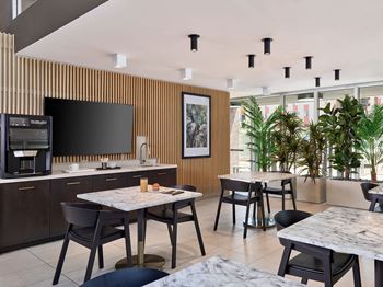Hot beverage bar with dining area and tvs