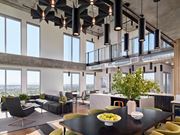 Phoenix apartment for rent - A modern dining room with a table set for two and a view of the city.