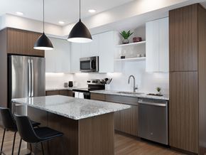 Phoenix apartment for rent - a kitchen with a island and a stainless steel refrigerator at AVE Phoenix Terra, Arizona, 85003