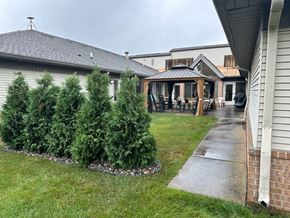 Saginaw apartment for rent - a backyard with a gazebo and a yard with trees